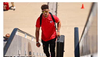 Chiefs players wearing red Hawaiian shirts on Flight to Miami