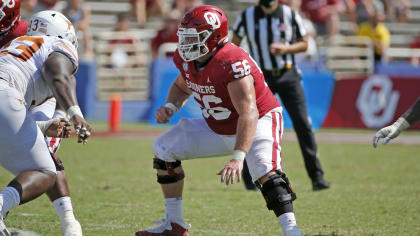 Kansas City Chiefs center Creed Humphrey (52) gets set on the line