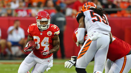 27 August 2010: Chiefs defensive back Brandon Carr (left) attempts to bring  down Eagles running back Mike Bell (26). The Philadelphia Eagles defeated  the Kansas City Chiefs 20 to 17 at Arrowhead