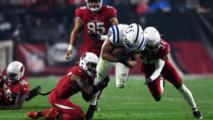 Indianapolis Colts guard Danny Pinter (63) points to the defense before the  snap during an NFL football game against the New England Patriots,  Saturday, Dec. 18, 2021, in Indianapolis. (AP Photo/Zach Bolinger