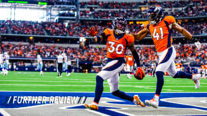 Why are Dallas Cowboys wearing red stripe on helmet vs. Broncos?