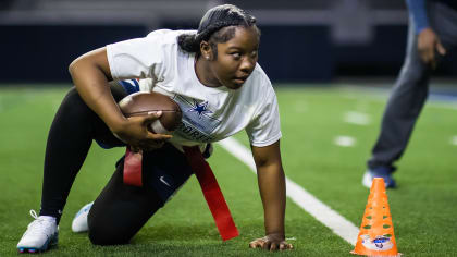 Children participating in the Play 60 program play a flag football game at  halftime of an NFL game between the Chicago Bears and Dallas Cowboys on  Sunday, Sept. 25, 2016, in Arlington