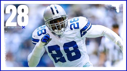 Dallas Cowboys safety Darren Woodson (28) stays down after being