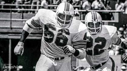 Larry Little of the Miami Dolphins leads running back Mercury