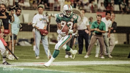 Miami Dolphin wide receiver Mark Clayton (83) sweeps over the goal after catching a Dan Marino pass in the fourth quarter of the AFC Wildcard Playoff game against, Saturday, Jan. 5, 1991 in Miami the Kansas City Chiefs. The touchdown clinched the game for Miami by a score of 17-16. (AP Photo/Doug Jennings)