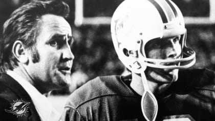 Coach of the Miami Dolphins' perfect season, Don Shula, with quarterback  Bob Griese during a halftime ceremony celebrating the undefeated 1972 team  as the Dolphins play host to the Cincinnati Bengals on