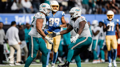 Zach Sieler and Raekwon Davis of the Miami Dolphins look on