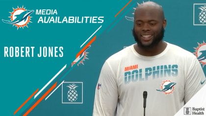 Miami Dolphins offensive lineman Robert Jones (65) smiles as he is