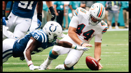 Miami Dolphins long snapper Blake Ferguson (44) performs a handshake with  safety Jevon Holland (8) during warmups ahead of an NFL football game  between the Miami Dolphins and the Denver Broncos, Sunday