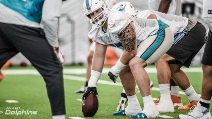 Miami Dolphins center Connor Hilland, left, and offensive guard