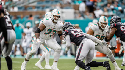 Miami Dolphins guard Austin Jackson (73) and center Alama Uluave