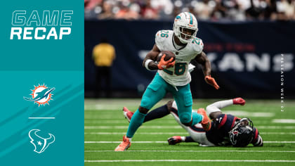 Miami Dolphins running back Salvon Ahmed (26) scores a touchdown as Chicago  Bears linebacker Caleb Johnson (92) defends during the first half of a  preseason NFL football game, Saturday, Aug. 14, 2021