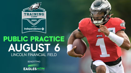 Member of the US military holds up the signed practice worm jersey of  Philadelphia Eagles quarterback Jalen Hurts for the Back Together  Saturday during practice at NFL football training camp, Saturday, July