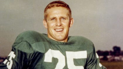 Tommy McDonald, All-America Oklahoma back, poses with a new number, head  gear and ball after he signed with the Philadelphia Eagles, Jan. 14, 1957,  to start a professional career in the NFL.