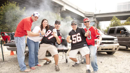 Fans tailgate before an NFL football game between the Atlanta