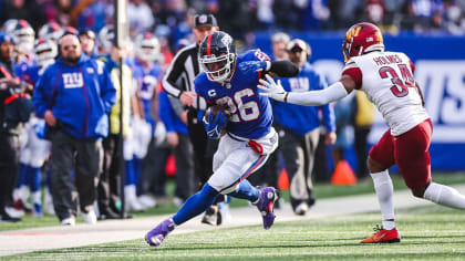 New York Giants Michael Strahan reacts to a sack in week 13 at