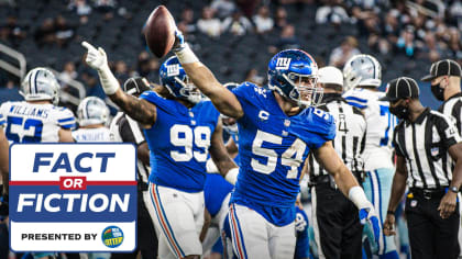 New York Giants defenders (91) Justin Tuck and (97) Kenderick Allen  celebrate a Dallas Cowboys turnover in week 13 at Giants Stadium in East  Rutherford, New Jersey on December 4, 2005. The