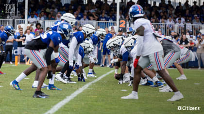 New York Giants tackle Evan Neal #73 walks off the field after their 31-27  loss to the New York Jets in an NFL pre-season football game, Sunday, Aug.  27, 2022, in East