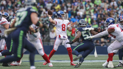 New York Giants quarterback Daniel Jones (8) passes against Seattle  Seahawks linebacker Uchenna Nwosu (10) as offensive tackle Andrew Thomas,  second from right, blocks defensive end Shelby Harris (93) during the second