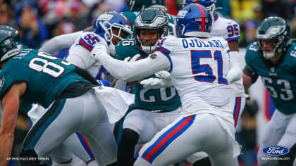 New York Giants' running back Rocky Thompson (22) is dumped head first by Philadelphia  Eagles defense when he attempted to score from five yard line on first down  play in first quarter