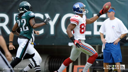 The Philadelphia Eagles' Nick Foles (9) congratulates Michael Vick (7)  after a touchdown drive against the Carolina Panthers during the second  quarter in preseason action at Lincoln Financial Field in Philadelphia,  Pennsylvania