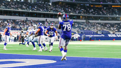 Andrew Thomas of the New York Giants reacts as he walks off the