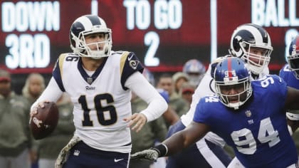 Los Angeles Rams halfback Jerry Williams carries the football