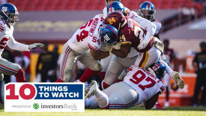 Washington Commanders defensive end Montez Sweat (90) looks across the line  of scrimmage alongside safety Kamren Curl in the second half of an NFL  football game against the Atlanta Falcons, Sunday, Nov.