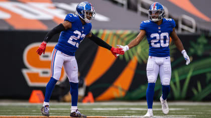 Defensive back Derrick Martin (22) of the New York Giants celebrates with  kids on the field at the end of Superbowl XLVI at Lucas Oil Stadium in  Indianapolis, Indiana on February 05