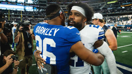 Dallas Cowboys' Roy Williams (11) and Tennessee Titans' Vince Young (10)  chat on the field after their pre-season game at Cowboys Stadium in  Arlington on Friday, August 21, 2009. Though playing for