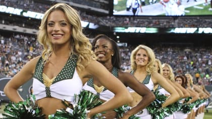 A New York Jets Flight Crew cheerleader dances during a time out in the  game against the New England Patriots in week 2 of the NFL season at Giants  Stadium in East