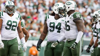 New York Jets Mike Catapano watches Muhammad Wilkerson tackle