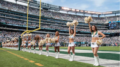 A New York Jets Flight Crew cheerleader dances during a time out in the  game against the New England Patriots in week 2 of the NFL season at Giants  Stadium in East