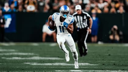 Detroit Lions wide receiver Kalif Raymond (11) is tackled by