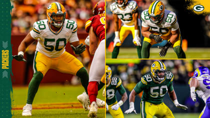 Green Bay Packers guard Zach Tom (50) runs on the field during the first  half of