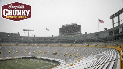 Fans shovel the frozen tundra of Lambeau Field