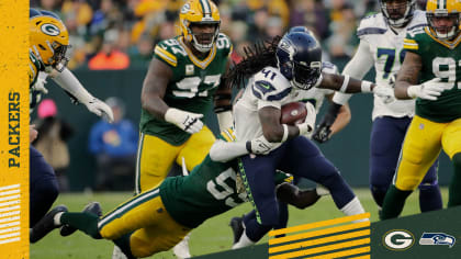 Seattle Seahawks wide receiver D'Wayne Eskridge (1) runs with the ball  during the second half of an NFL football game against the Green Bay  Packers, Sunday, Nov. 14, 2021, in Green Bay