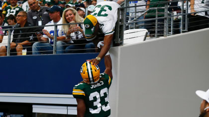 Green Bay Packer Aaron Jones flashes '915' after touchdown over Bills