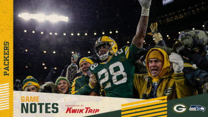 Green Bay Packers' A.J. Dillon (28) reacts after running for a touchdown  during the first half of an NFC divisional playoff NFL football game  against the San Francisco 49ers Saturday, Jan. 22