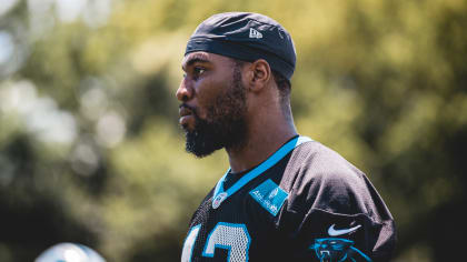 Panthers DE Brian Burns shows Haason Reddick his prize