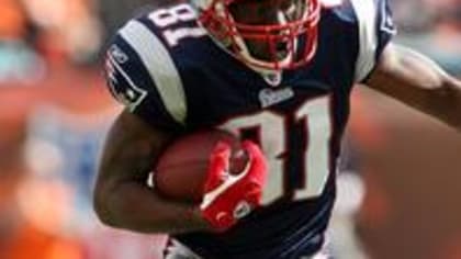 Faulk, Patriots hang on to beat visiting Rams