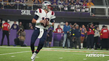 MINNEAPOLIS, MN - NOVEMBER 24: New England Patriots quarterback Mac Jones  (10) directs traffic while on the run during a game between the Minnesota  Vikings and New England Patriots on November 24