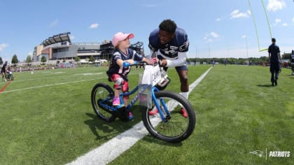 Broncos build bikes for local youth in honor of former coach