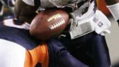 New England Patriots quarterback Tom Brady (12) sails after being hit by  Denver Broncos cornerback Aqib Talib on a first down run in the second  quarter during the AFC Championship game at