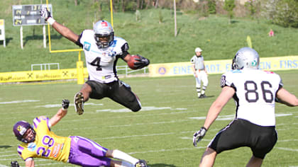 American football, WR Talib Wise, No. 4 Raiders, is tackled