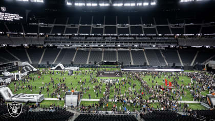 Green Bay Packers vs. Minnesota Vikings. Fans support on NFL Game.  Silhouette of supporters, big screen with two rivals in background. Stock  Photo