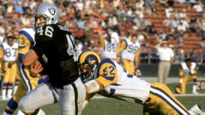 Quarterback Vince Ferragamo of the Los Angeles Rams drops back to  Nfl  football players, La rams football, New england patriots merchandise