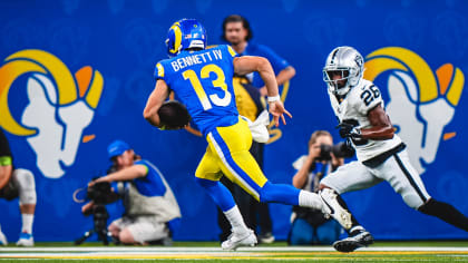 Los Angeles Rams quarterback Stetson Bennett (13) looks to throw a pass as  quarterback Matthew Stafford (9) watches him at the NFL football team's  training camp, Saturday, July 29, 2023, in Irvine