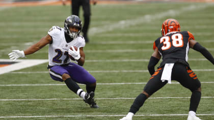 Baltimore Ravens running back J.K. Dobbins (27) runs out of the tunnel  prior to an NFL