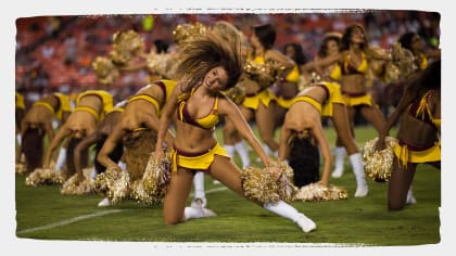 A member of the Washington Commanders cheerleaders performing on the field  during the second half of an NFL preseason football game against the  Cincinnati Bengals, Saturday, Aug. 26, 2023, in Landover, Md. (